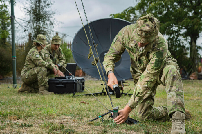 New Zealand soldiers with SATCOM equipment