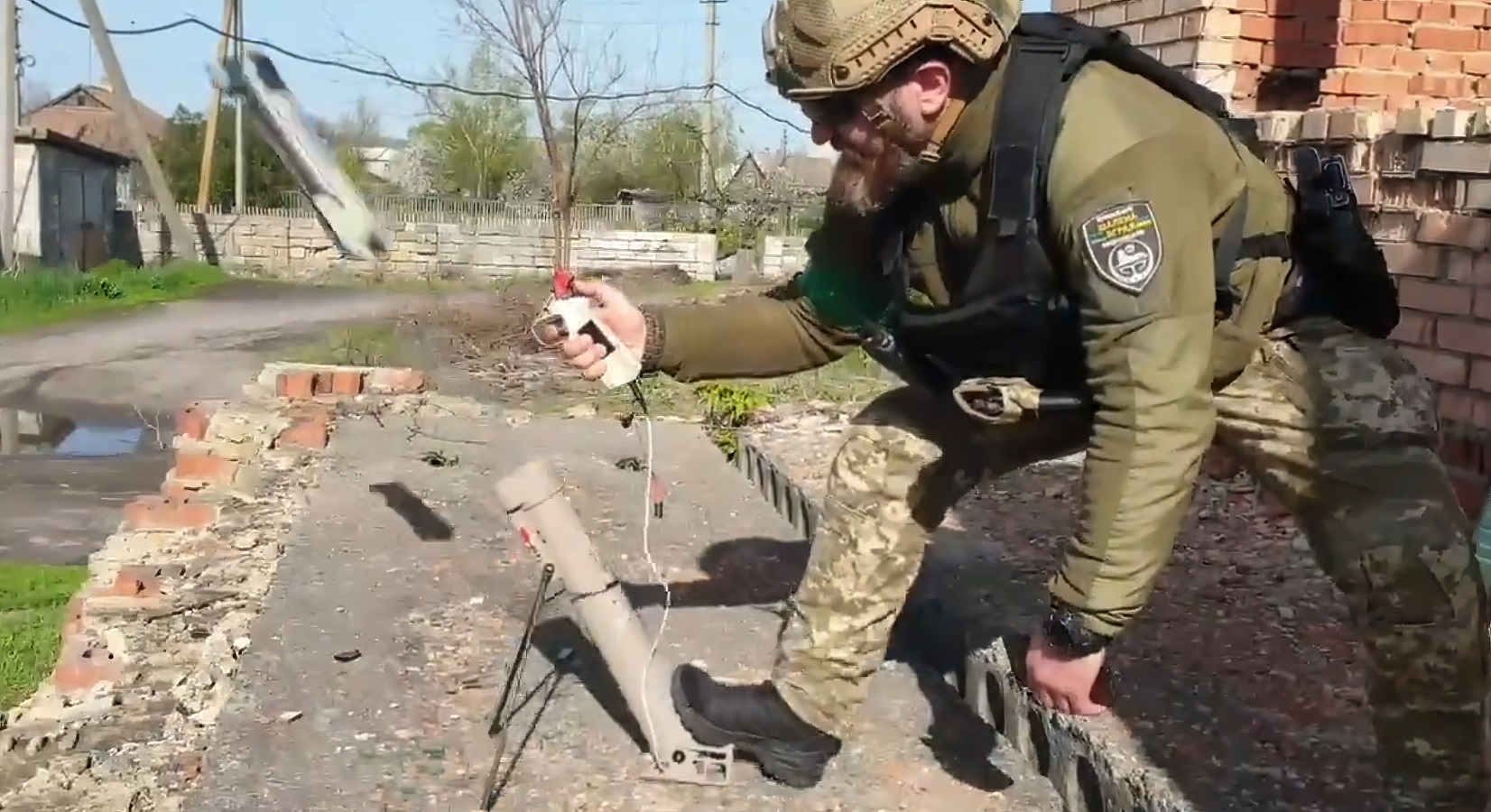 An Ukrainian soldier launches an Aerovironment Switchblade 300 loitering munition in May 2022. (Che Ua/Youtube)